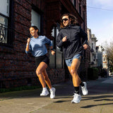Two runners showcasing road running shoes.