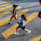Two runners showcasing women's road running shoes.